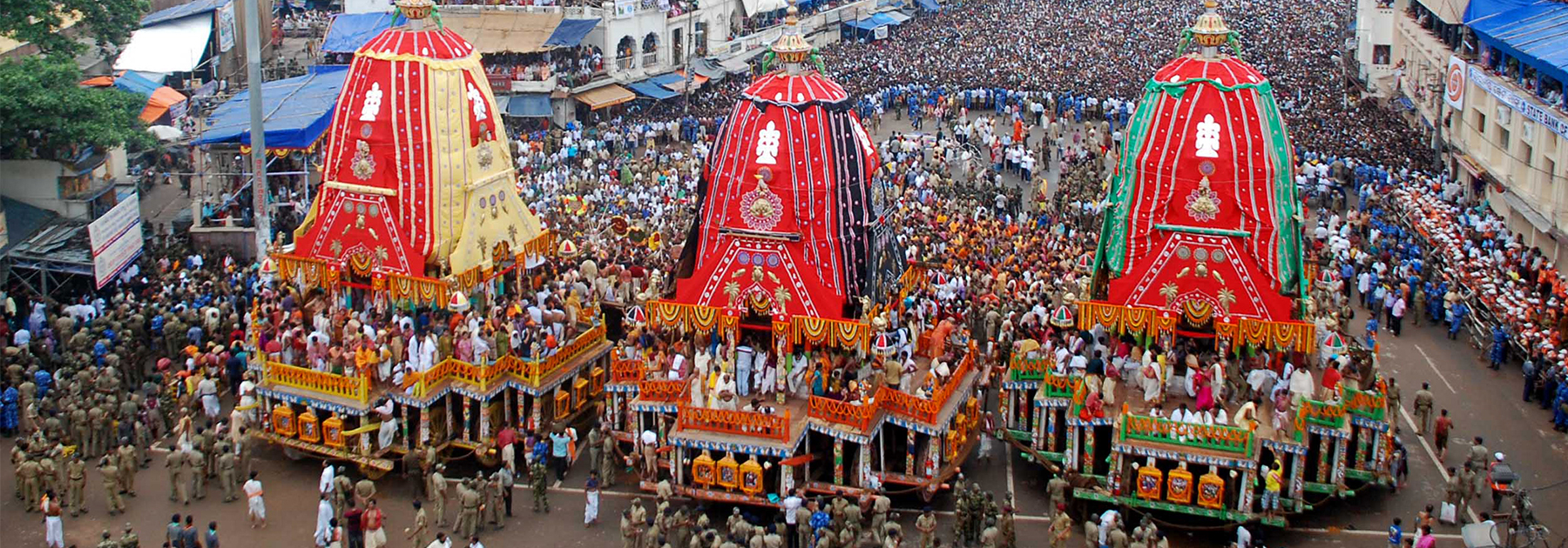 Hindu devotees gather as three giant chariots are pulled during the Rath Yatra of Lord Jagannath in Puri. (STR/AFP/GettyImages)
