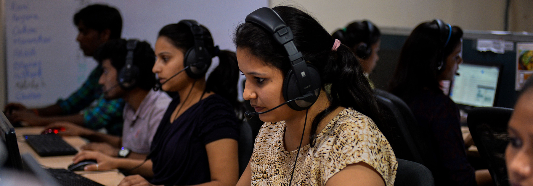 A woman works at a call center of TravelKhana, India’s vast railway network, in Noida. (CHANDAN KHANNA/AFP/Getty Images)