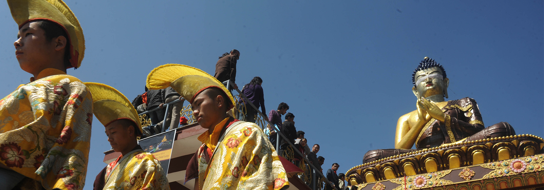 Buddhist monks walk at the 130 foot Lord Buddha statue during the Dzung ceremony as Buddha Park is unveiled on February 25, 2013. (DIPTENDU DUTTA/AFP/Getty Images)