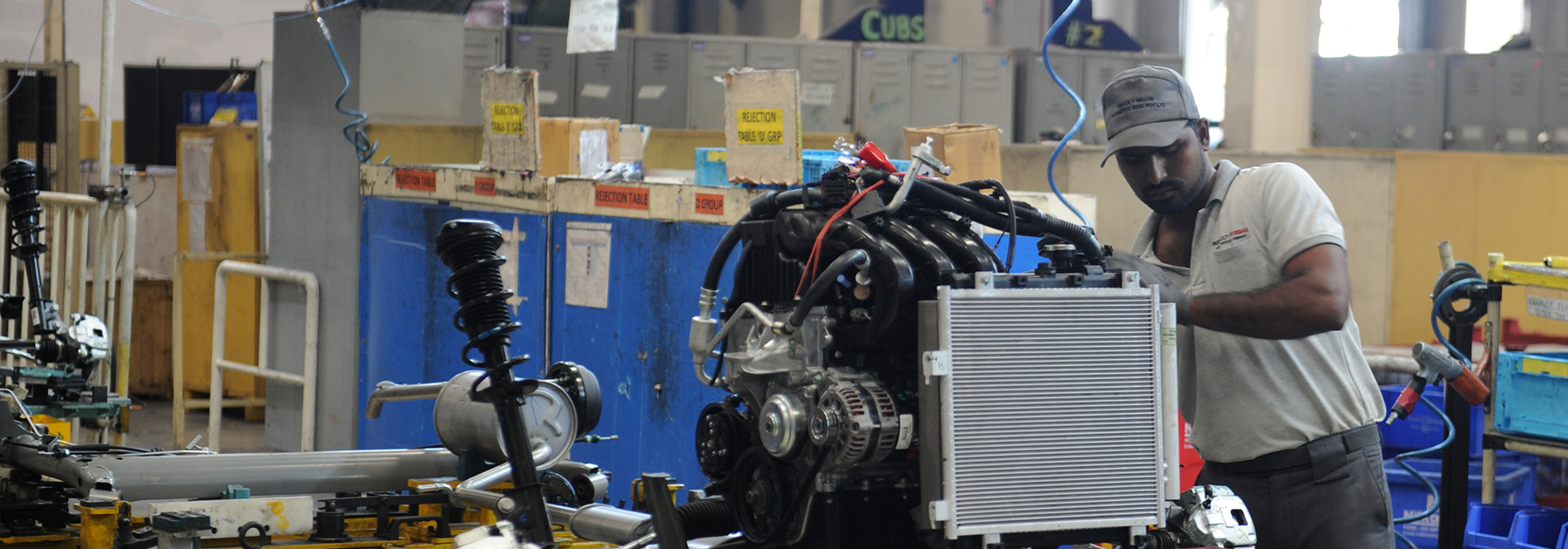 Workers labor on assembly lines of components for Datsun Go and Renault Kwid vehicles at Renault Nissan Automotive India factory in Chennai. (ARUN SANKAR/AFP/Getty Images)